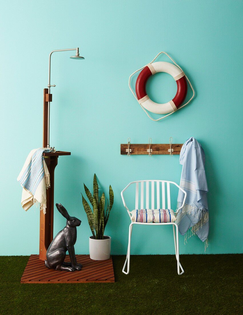 Accessories for garden and terrace: outdoor shower, hare ornament, Sansevieria, white metal chair, coat rack and lifebelt