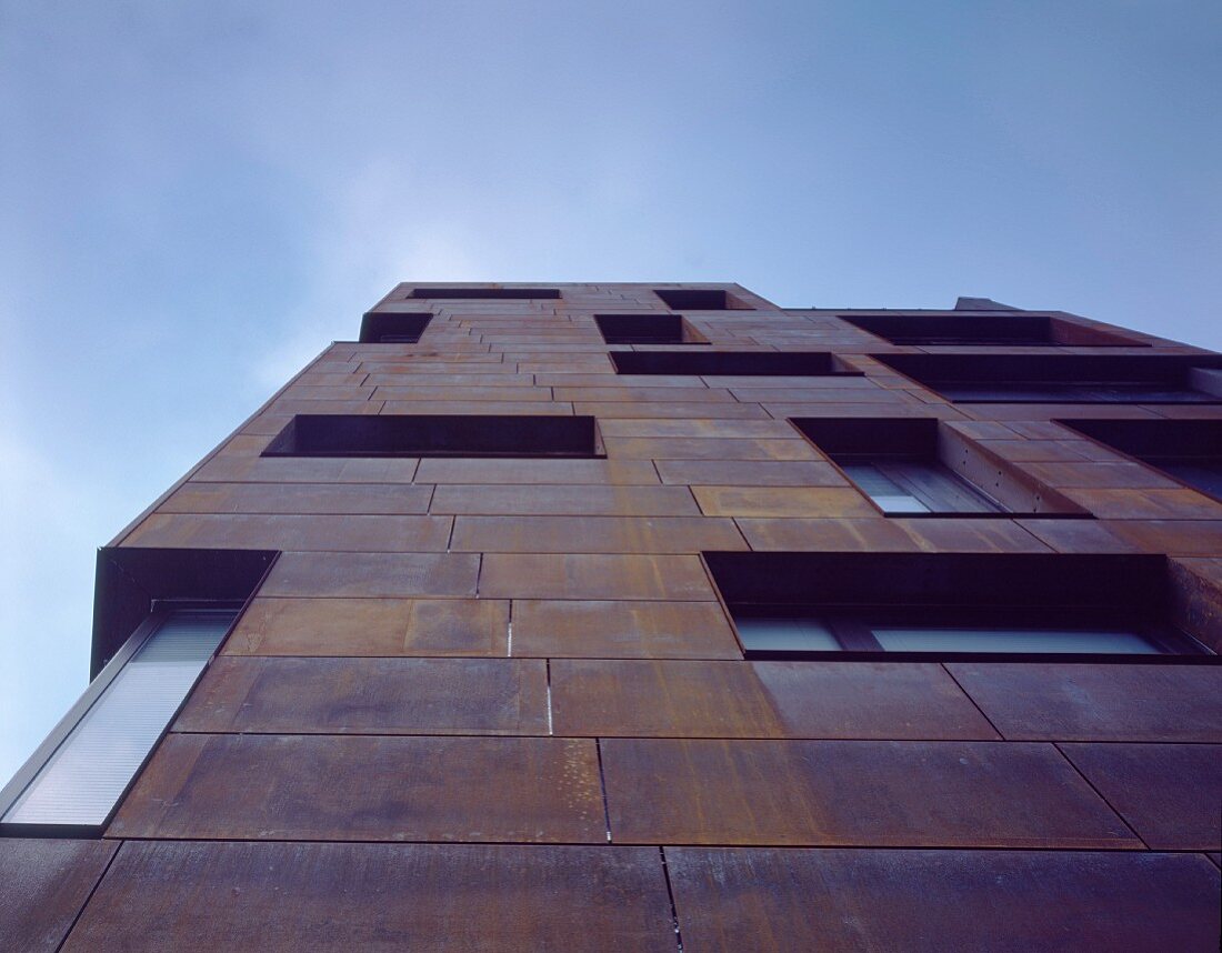 Apartment building with rusty Corten steel siding