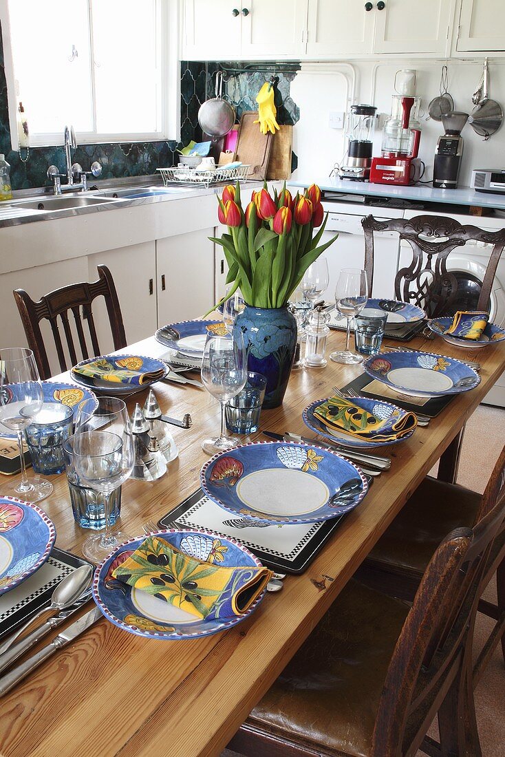 A table laid in the kitchen of a country house