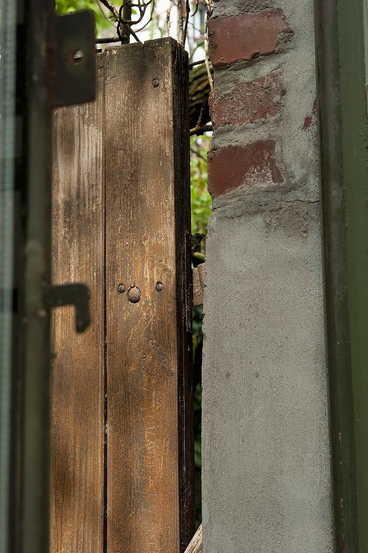 A door frame and a garden fence (detail)