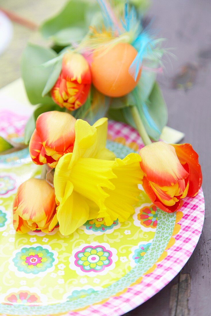 Easter bouquet with narcissus, tulips, Easter eggs as a table decoration