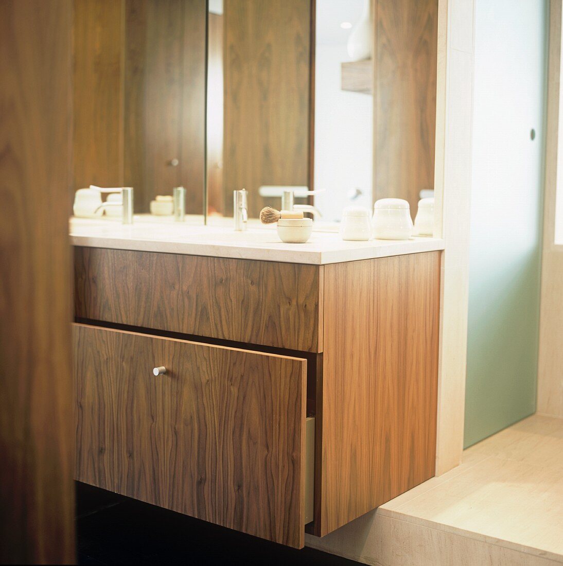 A modern wash stand with a built-in wooden drawer