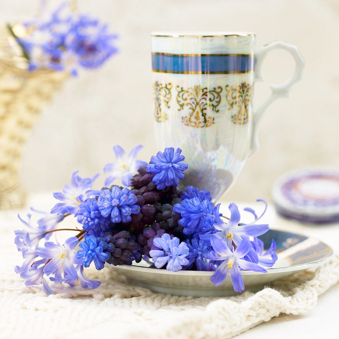 A bunch of hyacinths and a tea cup