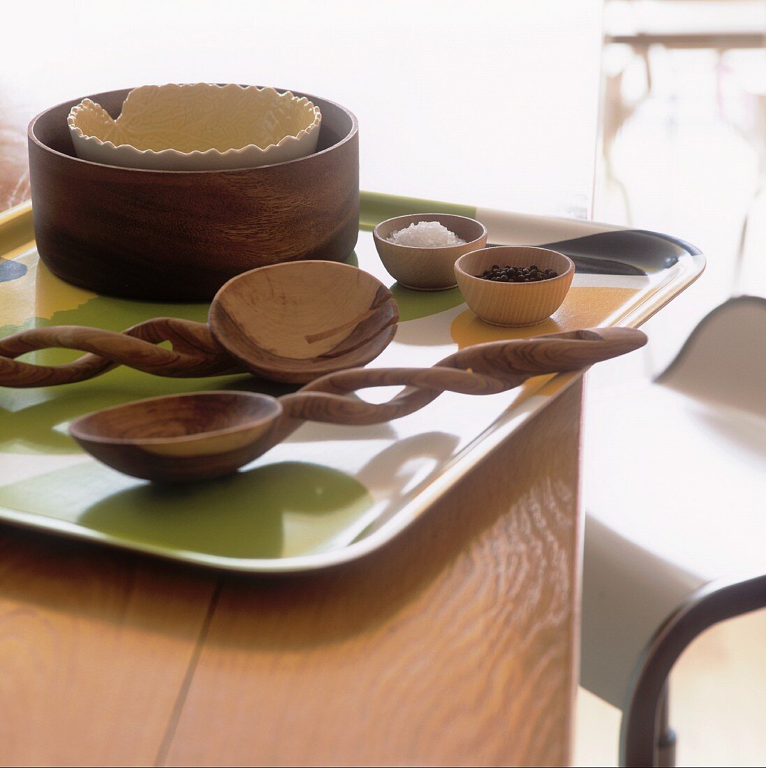 Wooden spoons and bowls on a tray