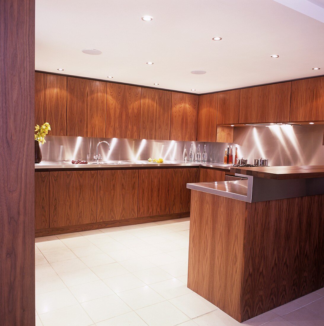 An illuminated kitchen with wooden cupboards