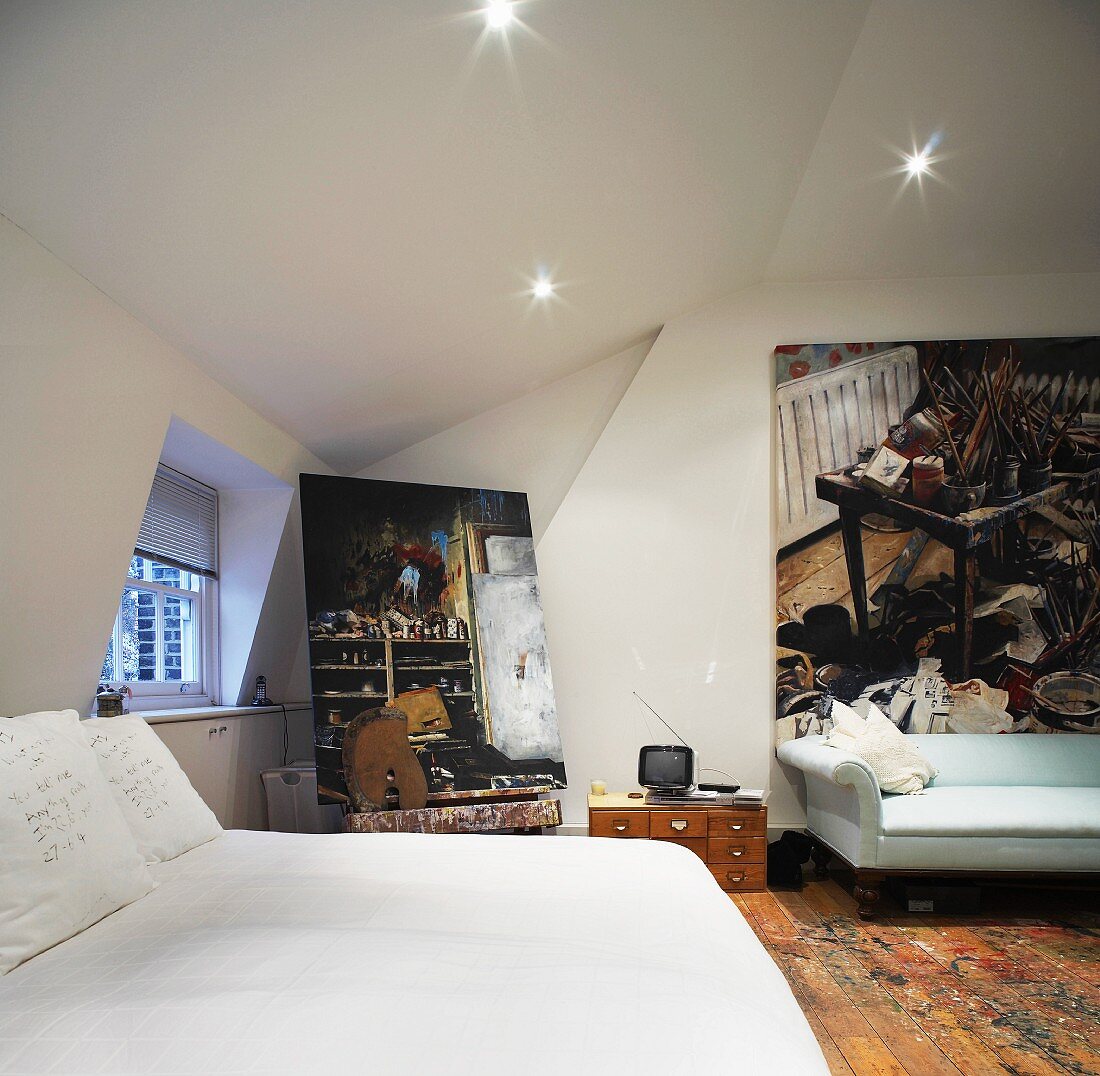 Bedroom with double bed and pictures on the walls