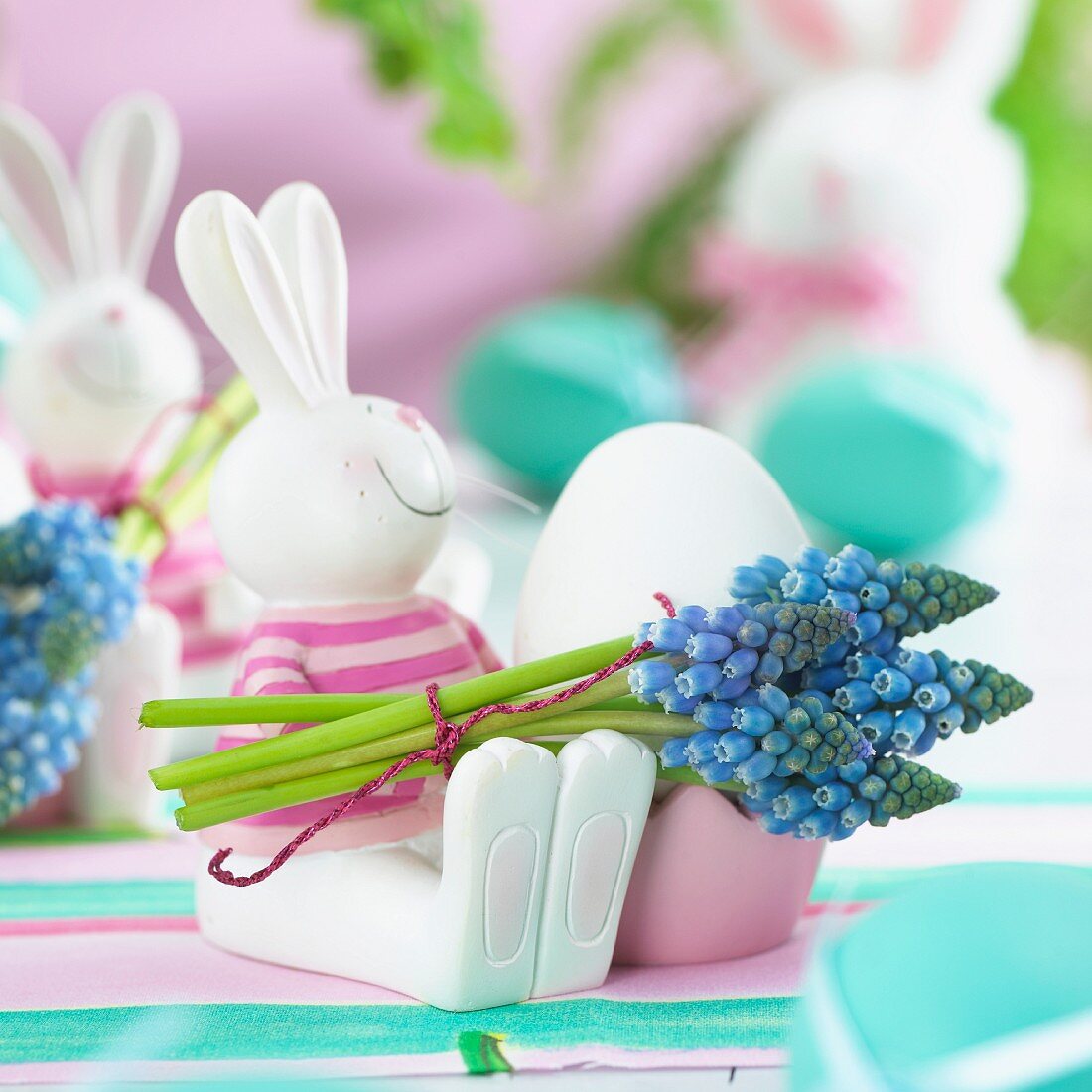 Easter bunny egg cups decorated with hyacinth flowers
