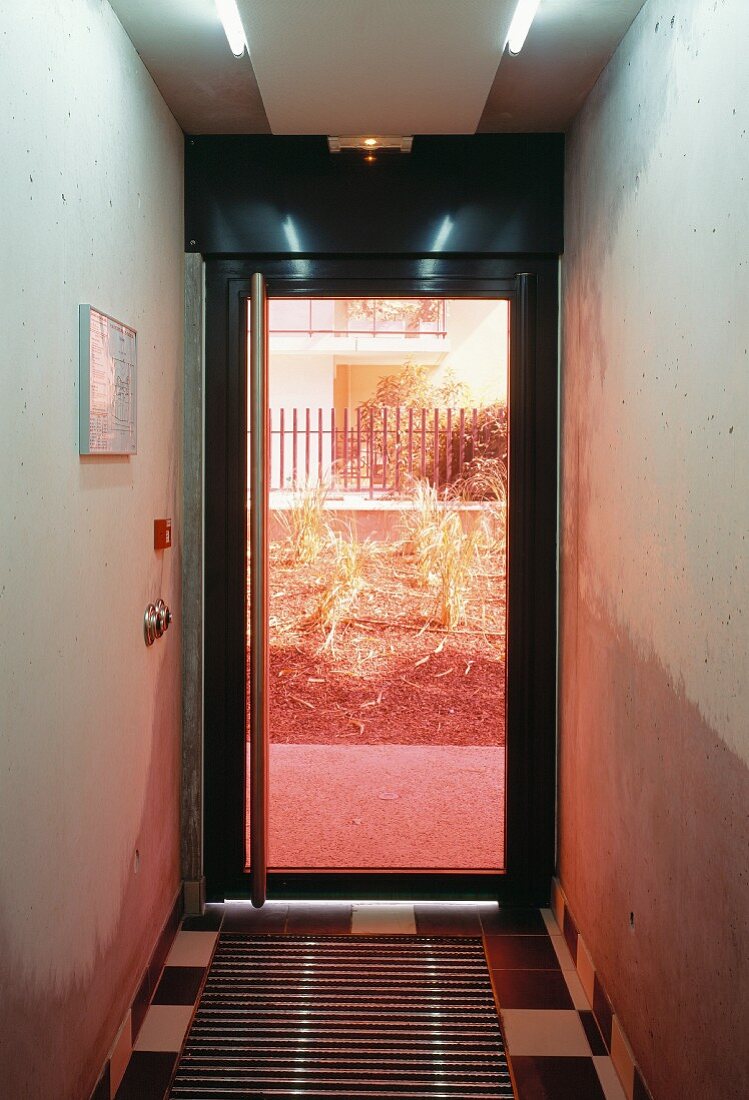 Simple, modern hallway with glass door