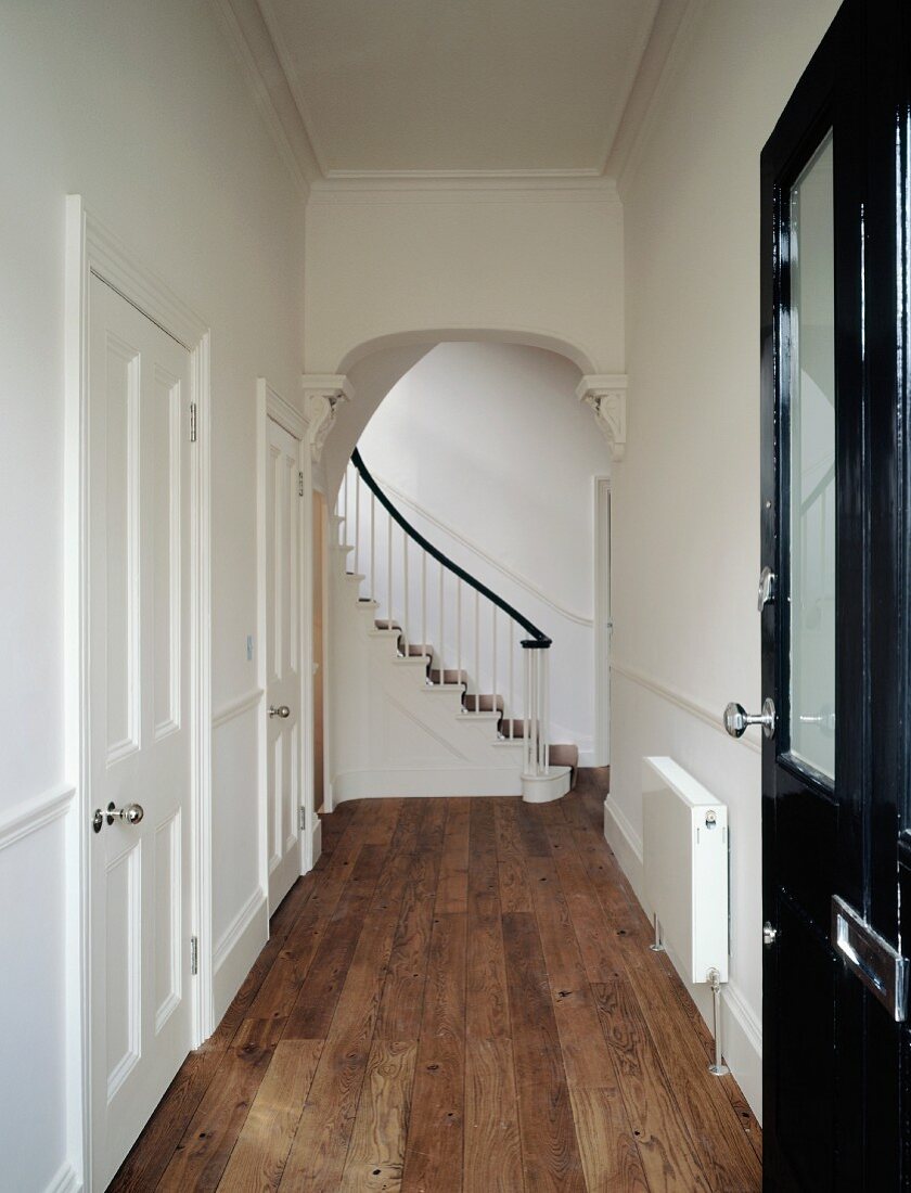 Modernised hallway in traditional house with view of stairwell
