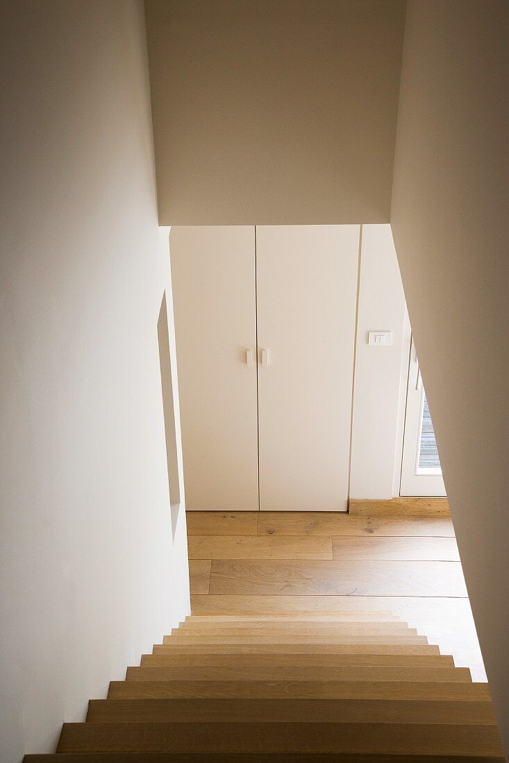 Minimalist staircase in contemporary maisonette apartment