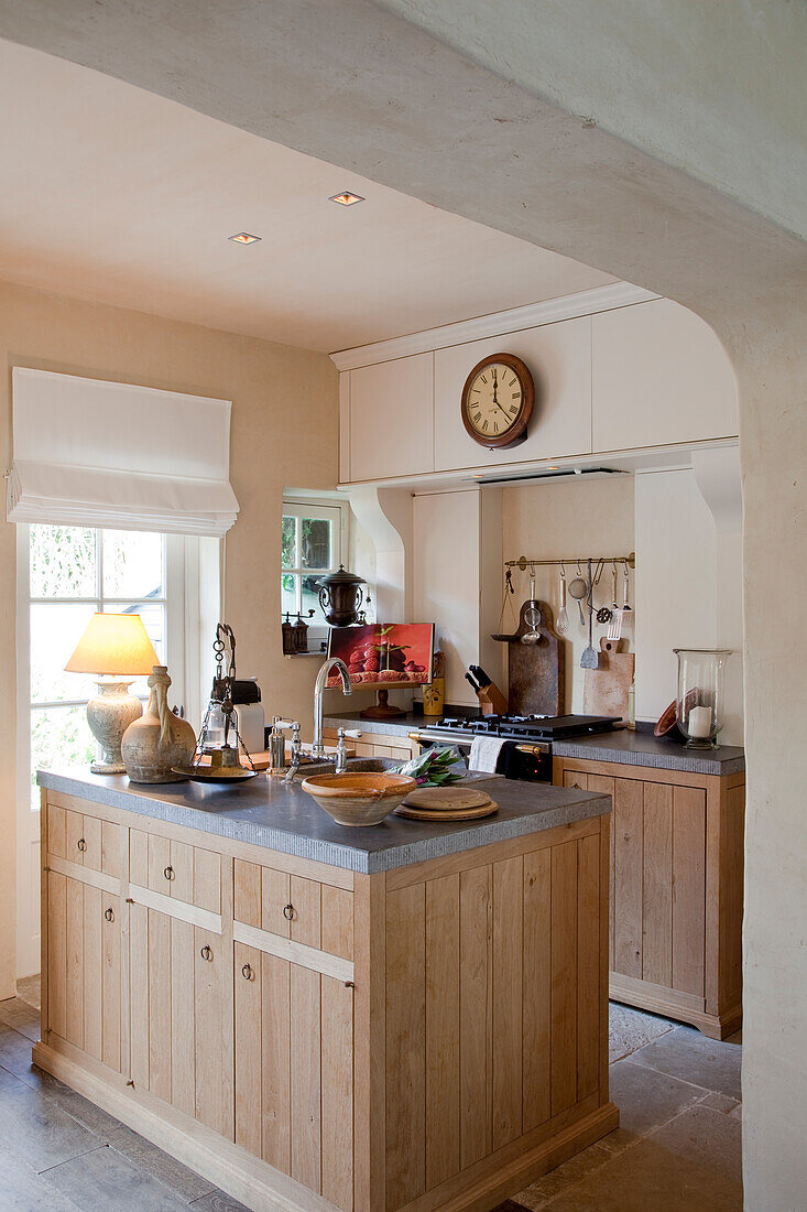 Simple, country-house kitchen with free-standing central island