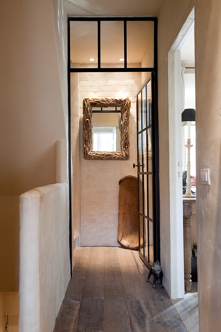 Simple stairwell and open door with view into foyer