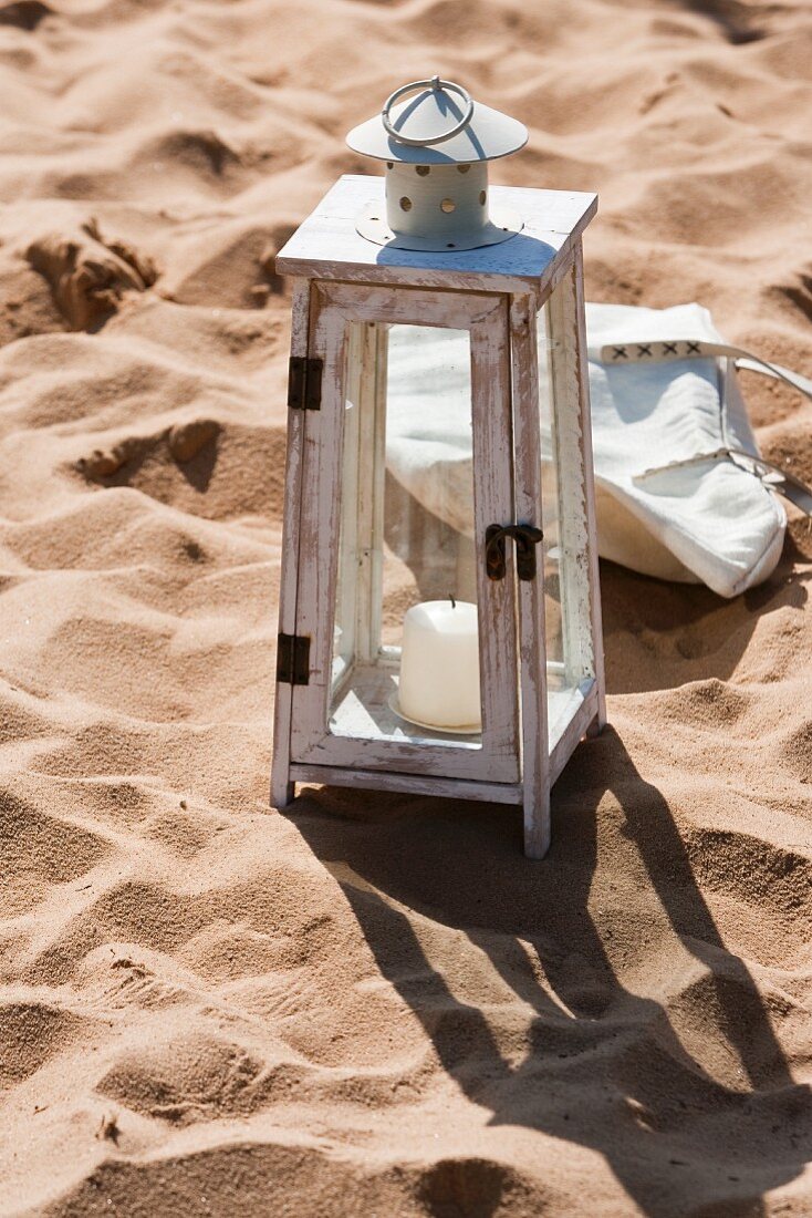 A lantern on a beach