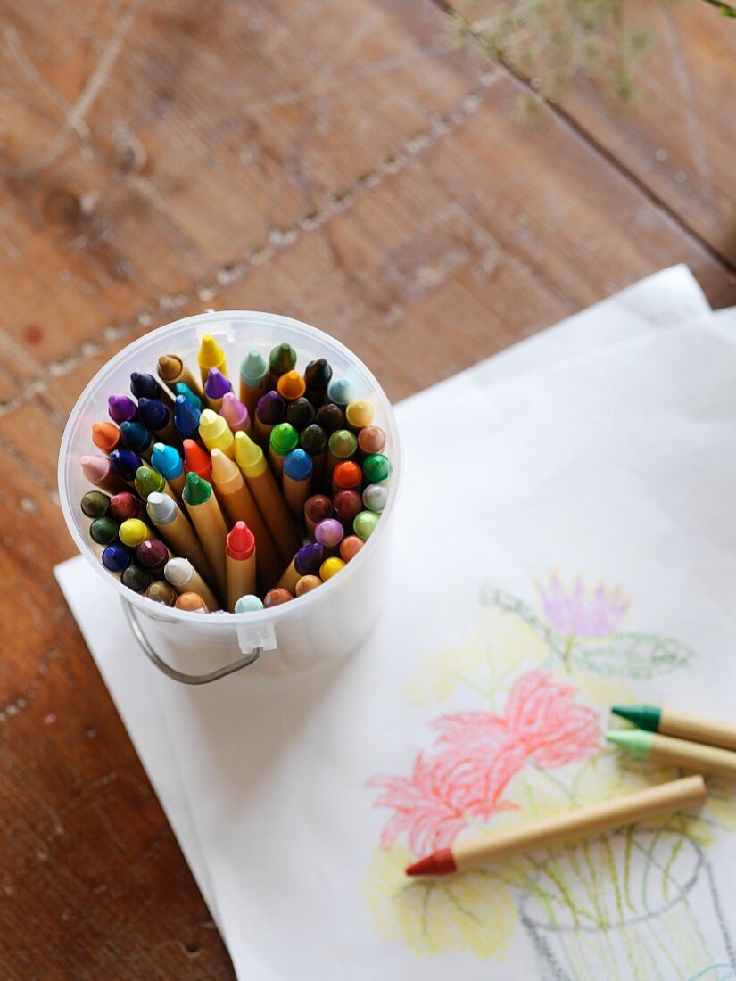 Child's drawing and coloured crayons