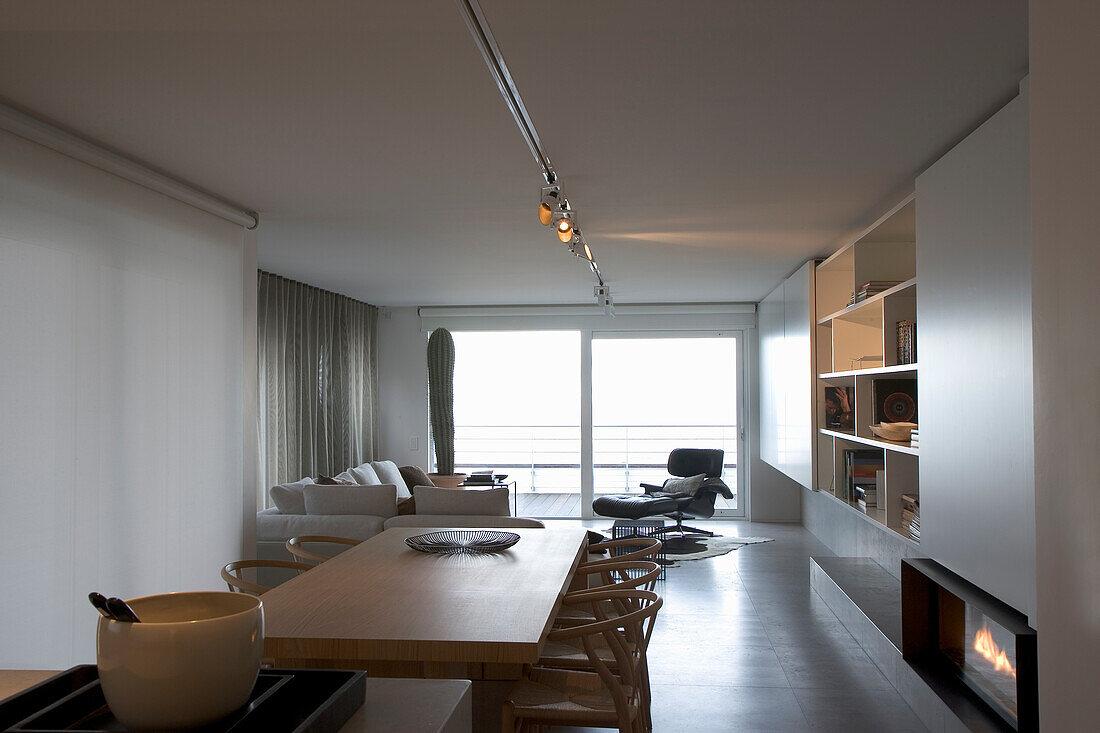 Open-plan living and dining area with fireplace