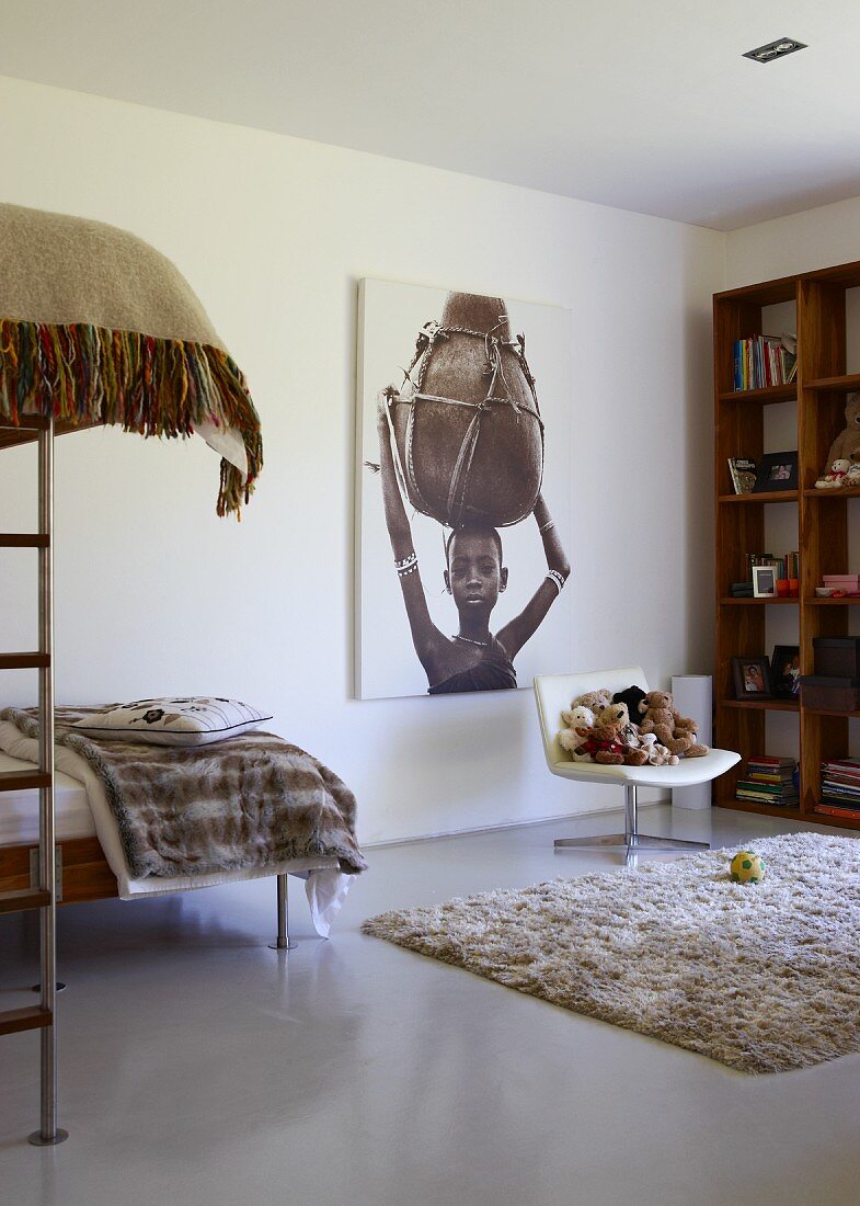 Bedroom in warm natural tones with black and white photo of African girl with large jug on her head