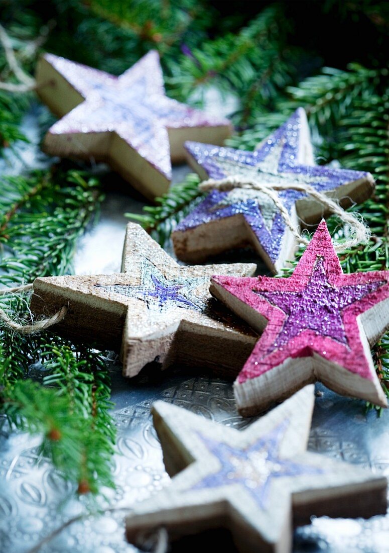 Hand-crafted wooden stars as Christmas tree decorations