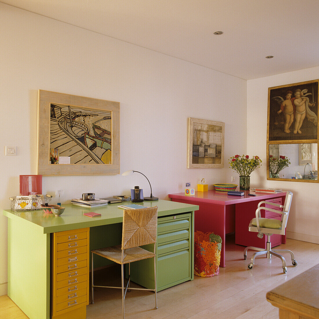 Colourful home office with green and pink desk