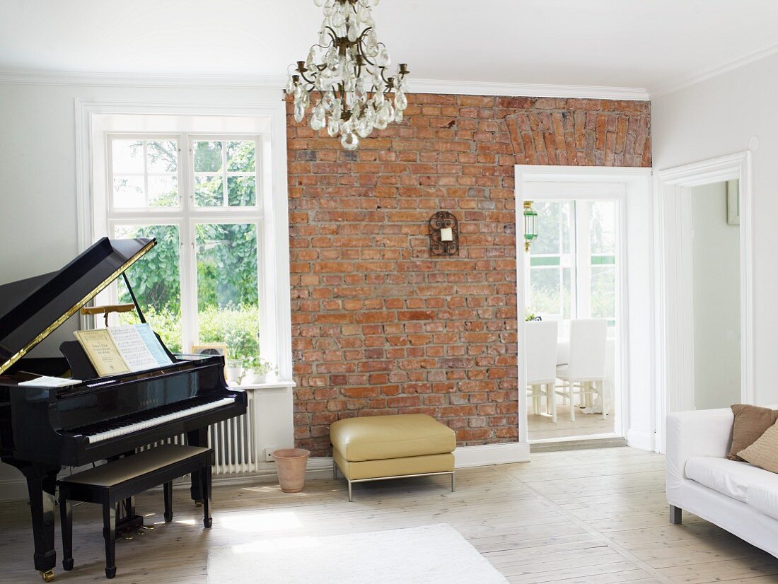 Piano and brick wall in music room