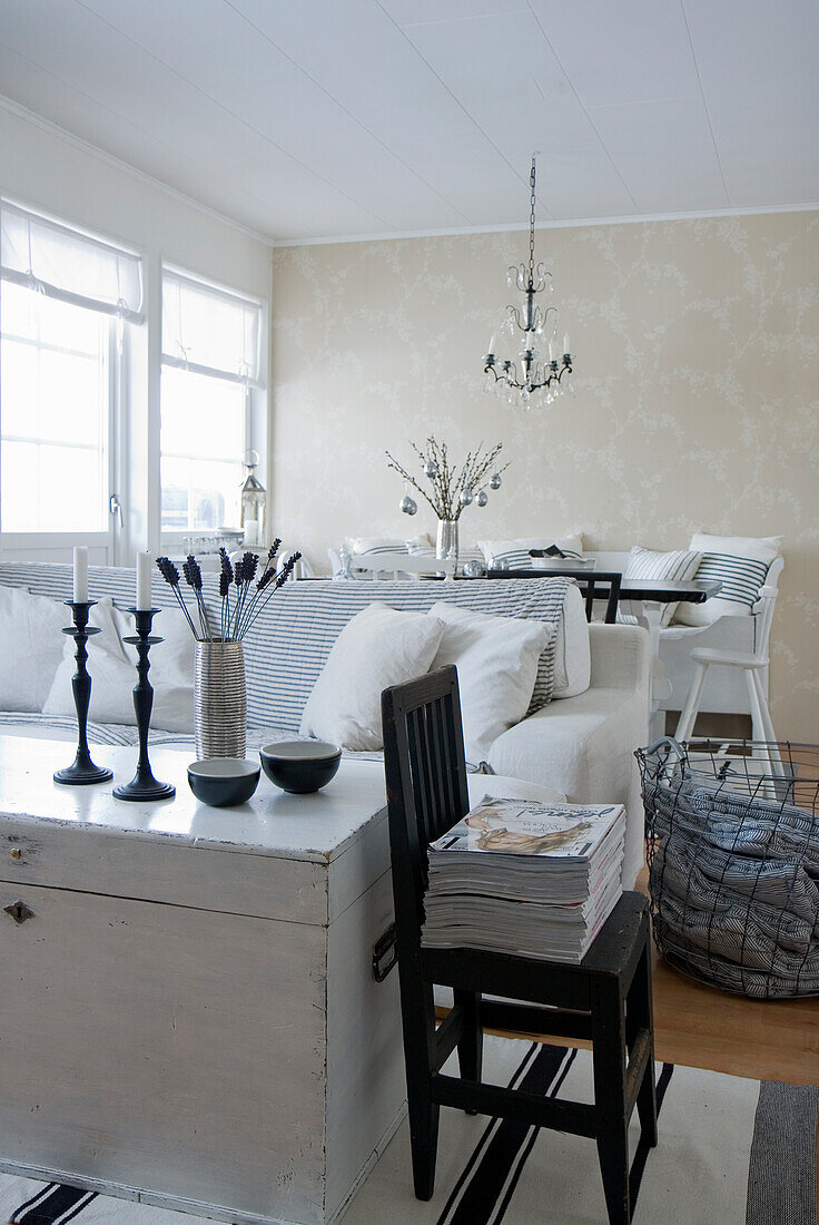 Bright dining room with white interior and decorative elements