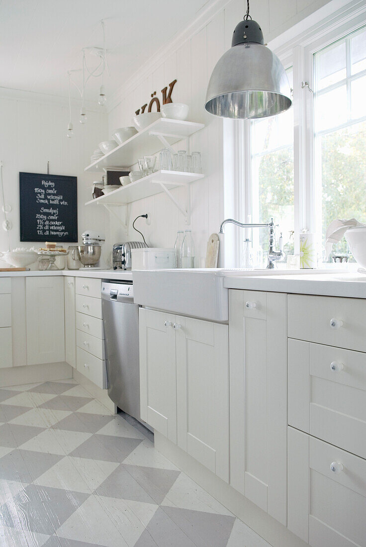 Bright country-style kitchen with pendant light