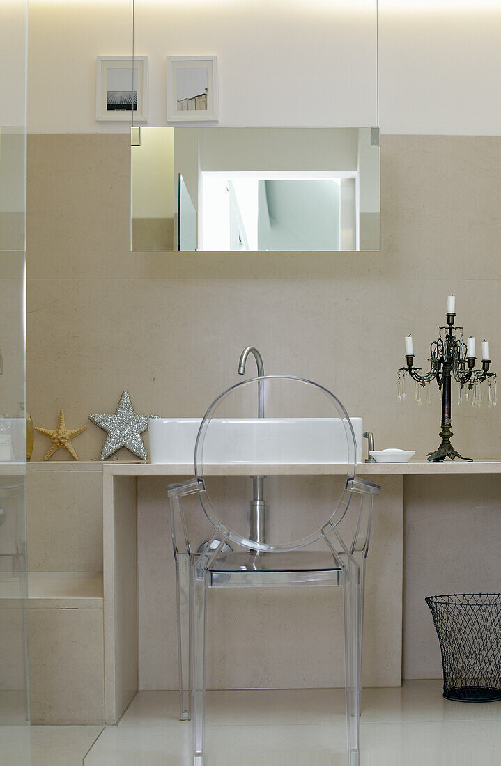 Bathroom with transparent chair and candlestick