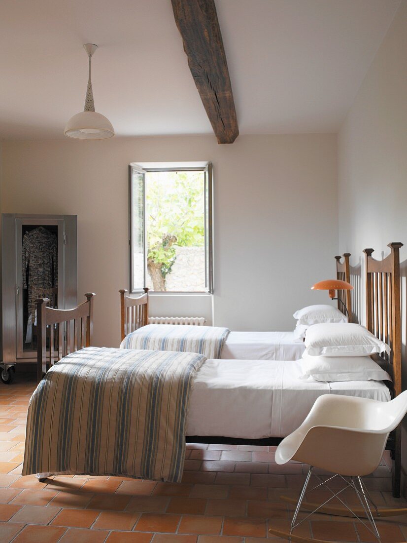 Single beds in rustic bedroom