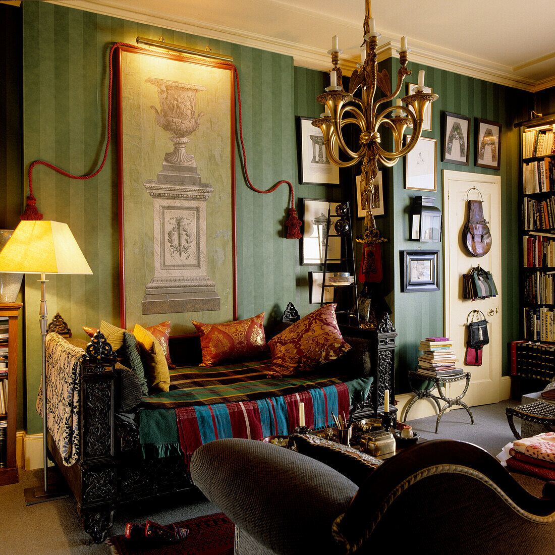 Living room with antique furniture and green wallpaper