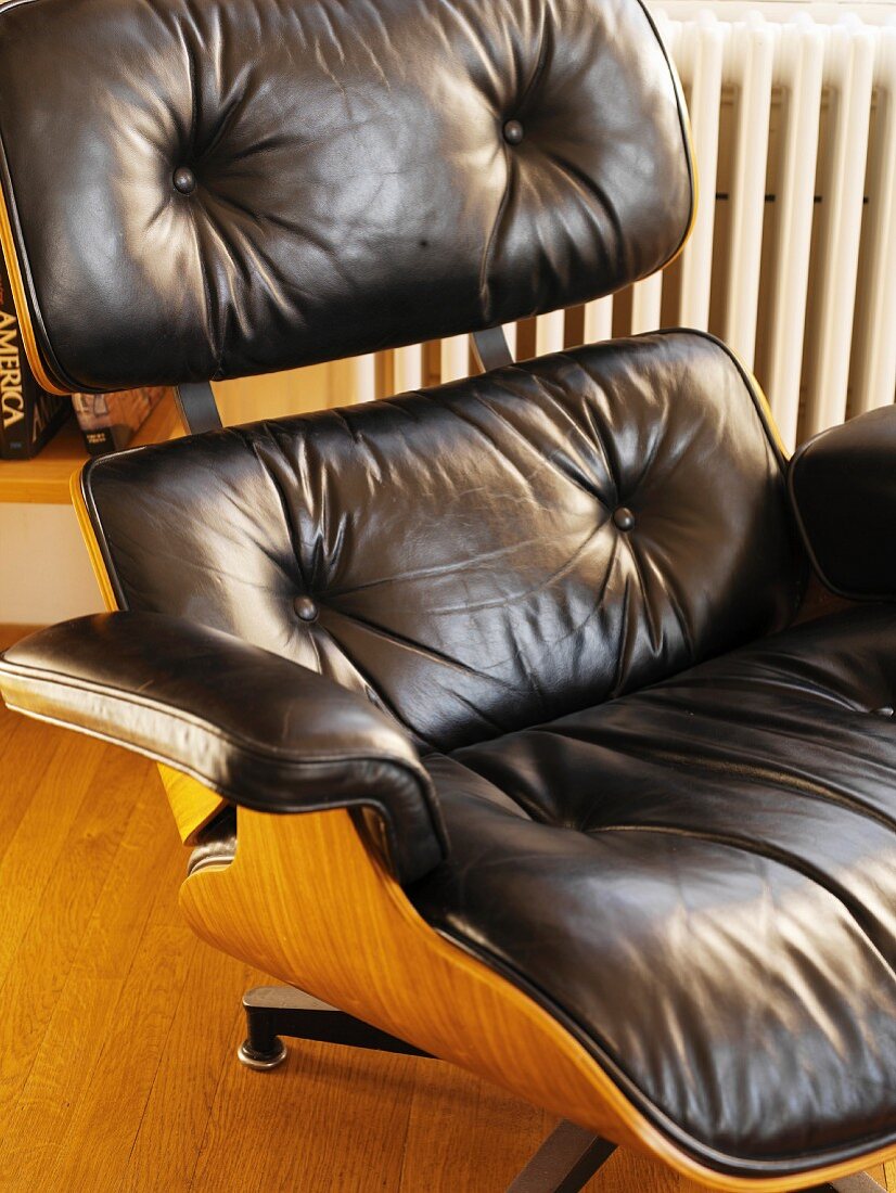 Armchair with brown leather upholstery