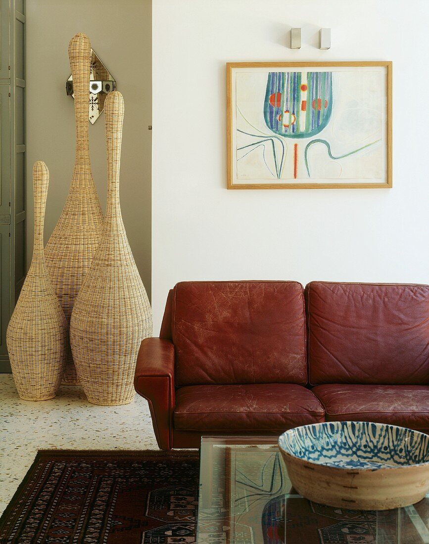 Sofa, coffee table & decorative wicker objects