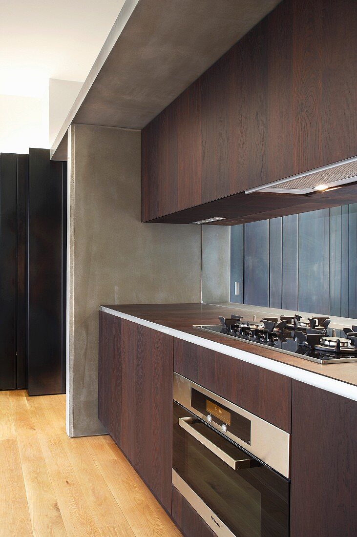 Dark wood fitted kitchen