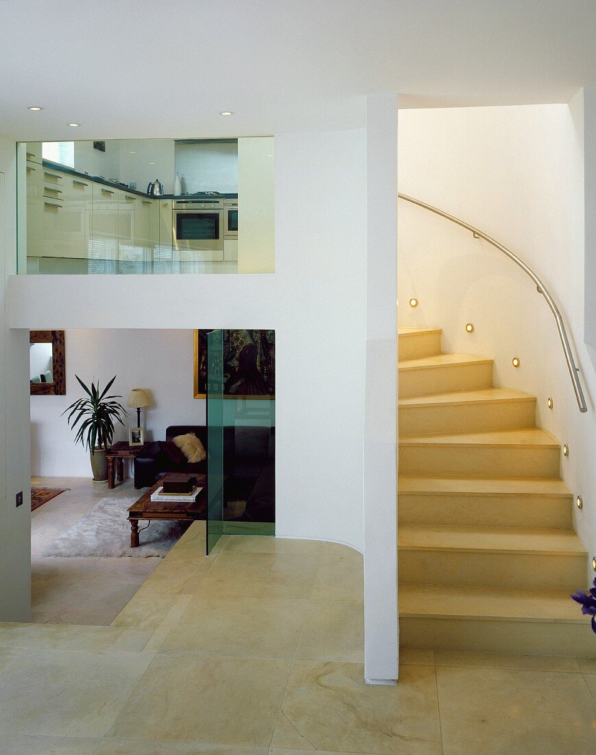 Staircase leading from living space to kitchen