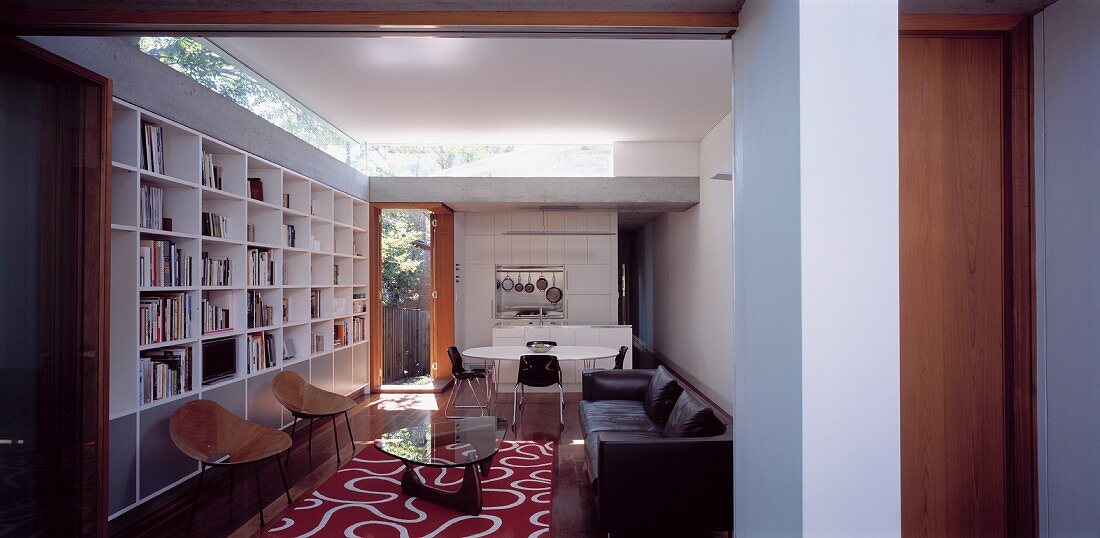 View of living room with shelving along one wall