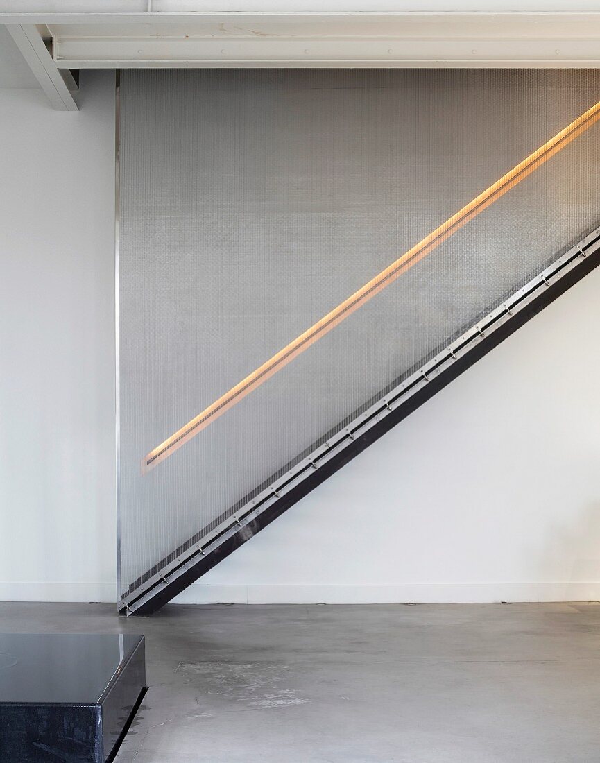 Staircase in living space with illuminated rail