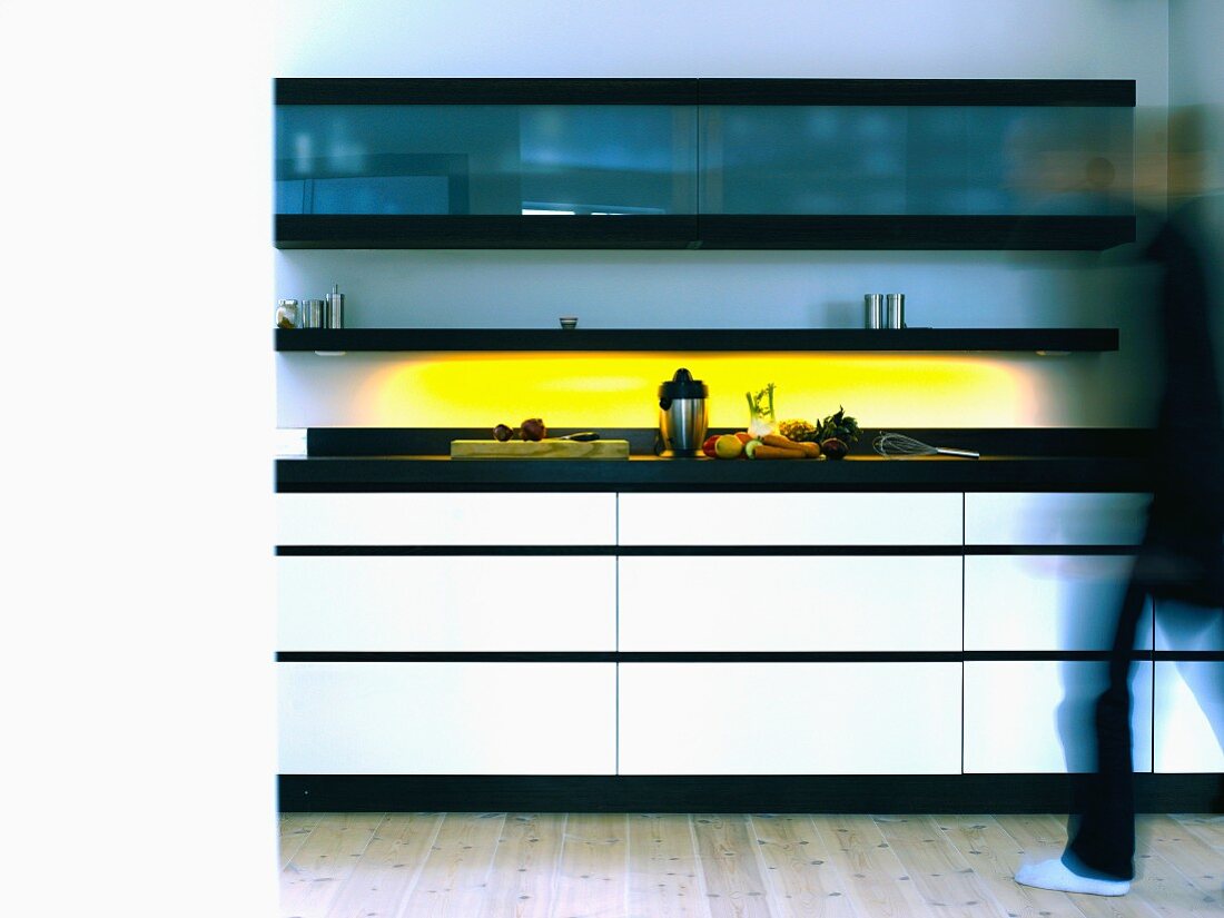Kitchen unit with yellow lighting