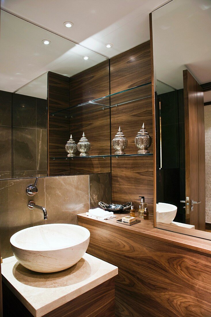Luxurious bathroom with nut wood panelling and designer wash stand