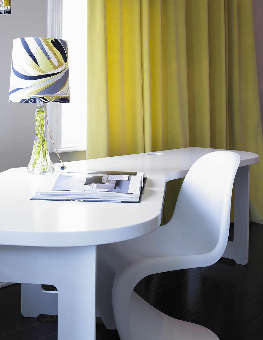 White modern desk with chair and patterned lamp