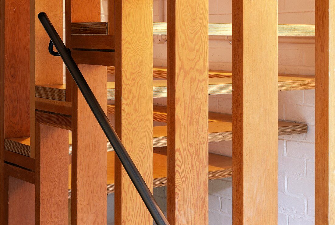 Wooden slatted partition in stairwell