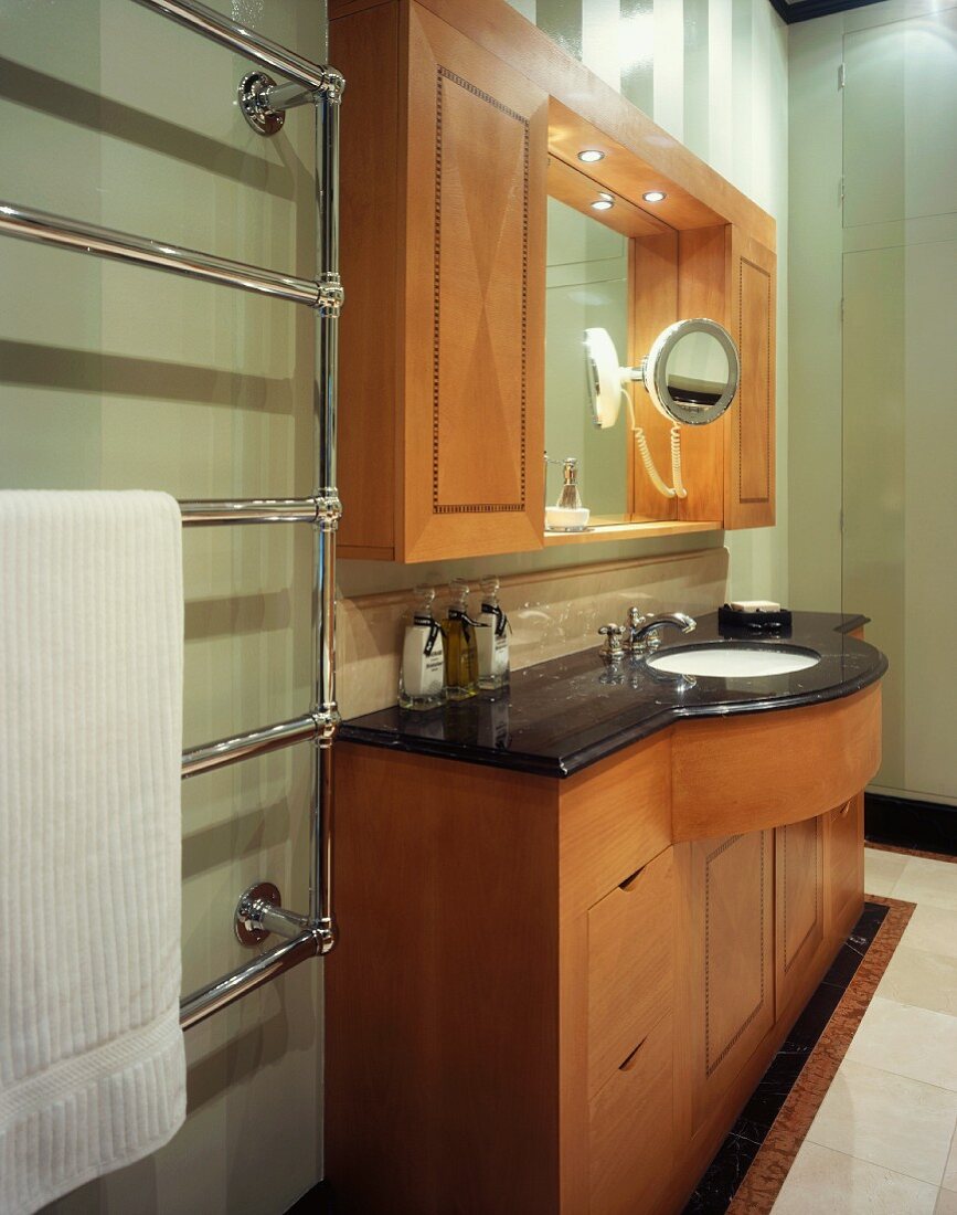 Wooden washstand with black stone top and matching wall cabinet