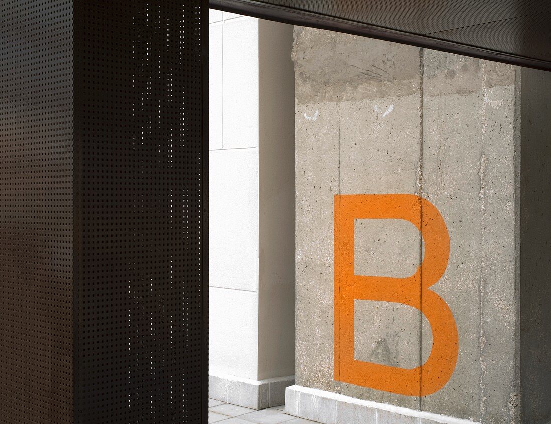 Letter B on concrete pillar