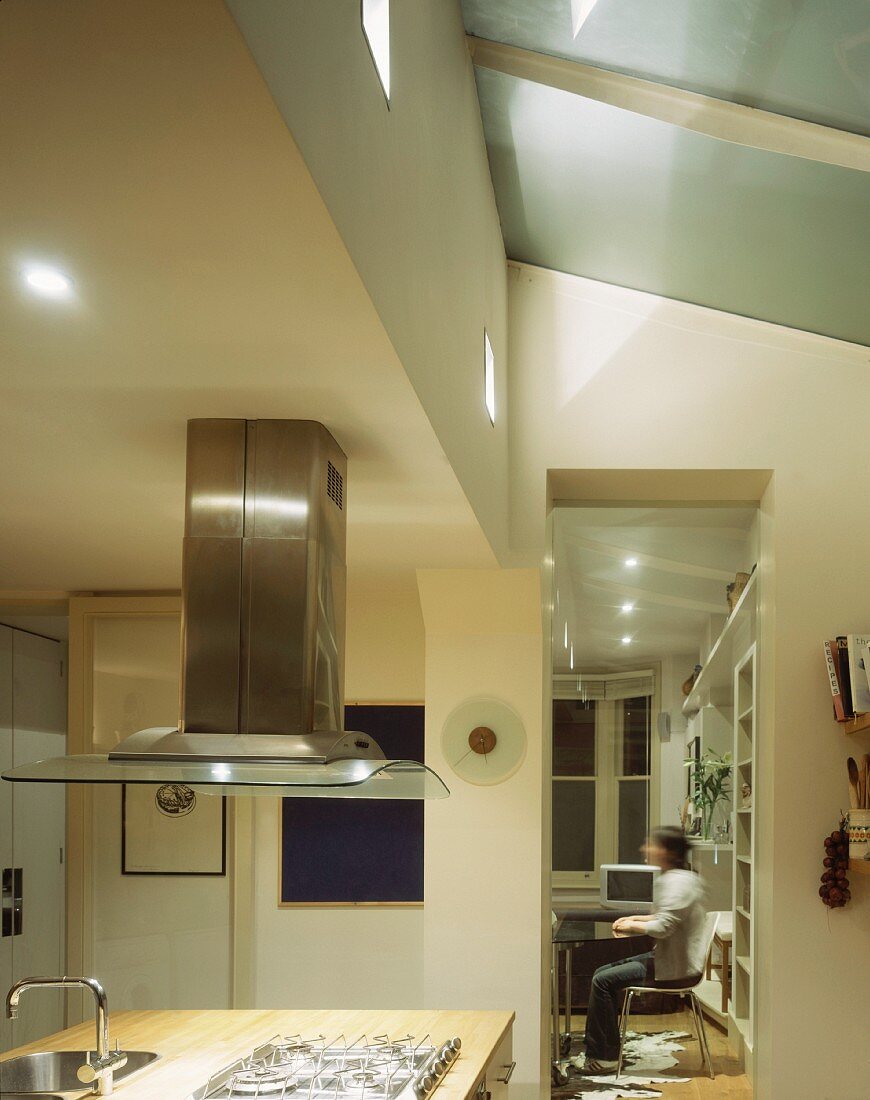 Kitchen with island and extractor hood