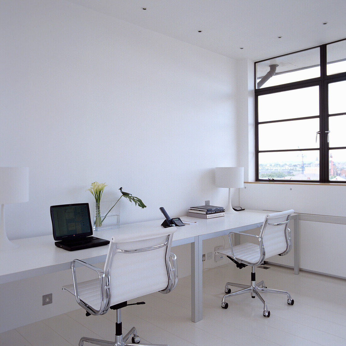 Modern home office with white furniture