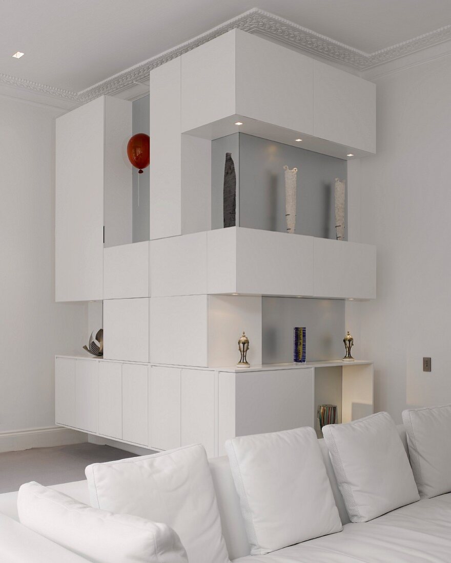 White, corner shelves with various ornaments