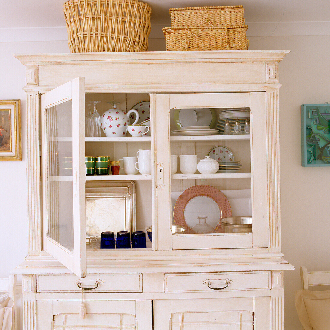 Kitchen buffet with crockery and baskets