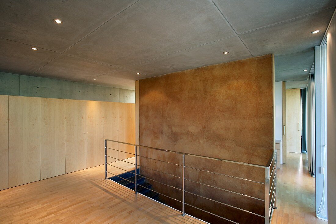Head of staircase in bare foyer of contemporary house