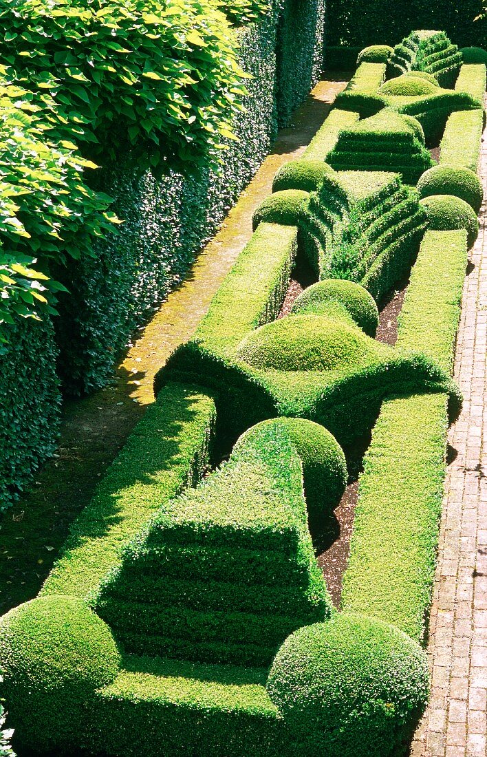 Spectacular gardens with topiary hedges and paved paths
