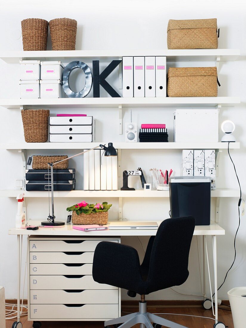 Work station with shelving on wall