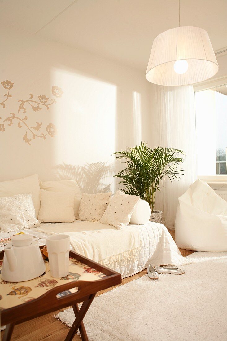 Scandinavian living room in white textiles