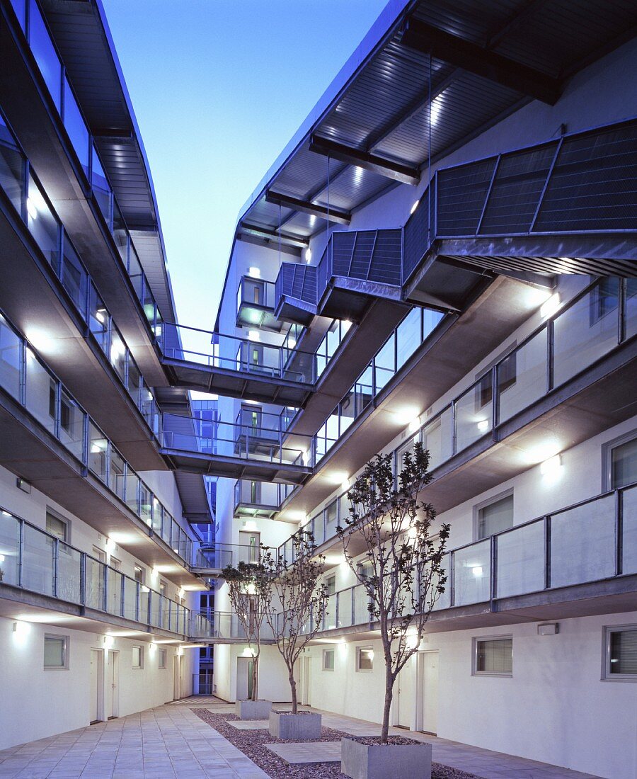 Apartment blocks with exterior walkways and glass bridges