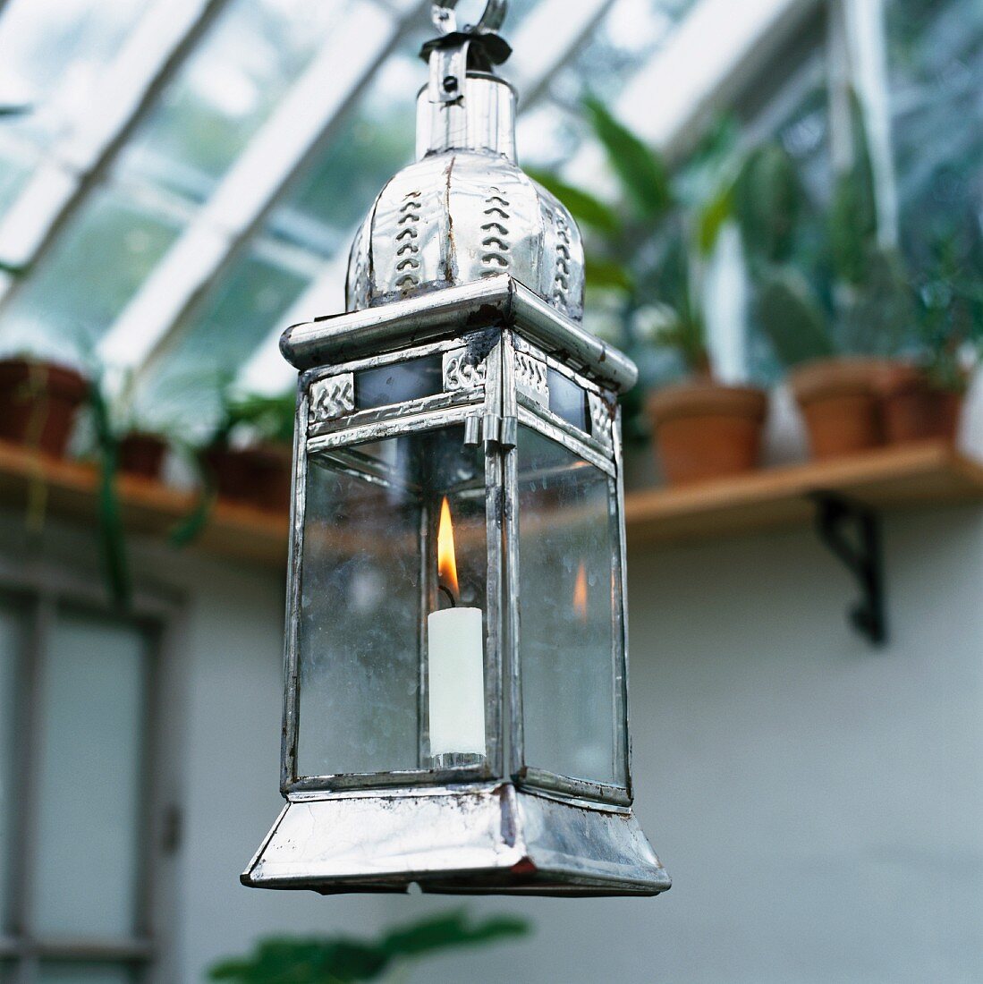 Lantern with burning candle